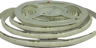A coil of pale silicone-sleeved COB tape on a white spool, the emitter line running continuously along it