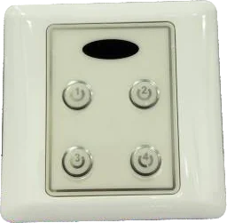 A glossy white four-button wall switch plate with a dark infrared receiver window above the buttons