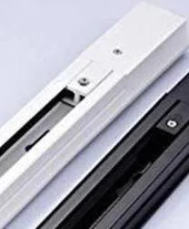 A length of surface-mounted lighting track with its black conductor channel running down the centre of a white extrusion