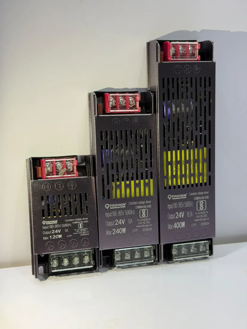 Three 24V constant-voltage drivers side by side — 120W, 240W and 400W — showing the vented steel housing and terminal block.